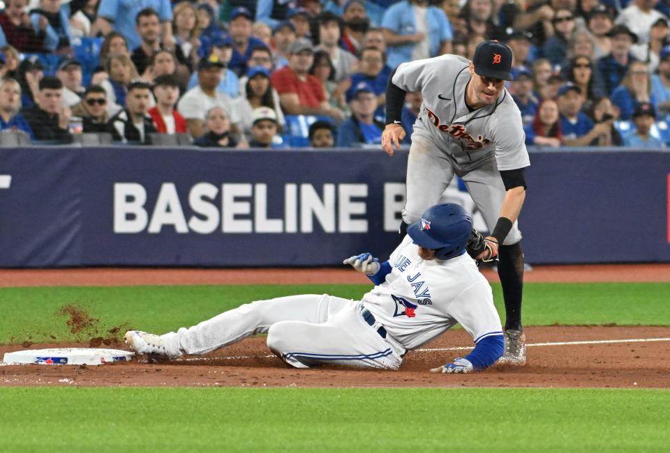 Toronto Blue Jays designated hitter Matt Chapman (26) is tagged out by Detroit Tigers third baseman Ryan Kreidler (32) in the sixth inning at Rogers Centre in Toronto on Wednesday, April 12, 2023.