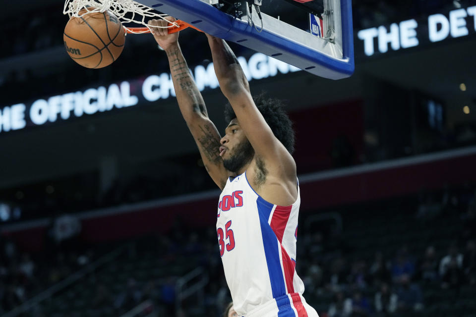 Detroit Pistons forward Marvin Bagley III dunks during the first half of an NBA basketball game against the Utah Jazz, Thursday, Dec. 21, 2023, in Detroit. (AP Photo/Carlos Osorio)