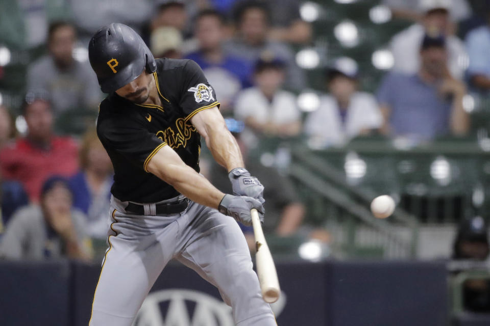 Pittsburgh Pirates' Bryan Reynolds hits a two-run single during the 10th inning of the team's baseball game against the Milwaukee Brewers on Tuesday, Aug. 3, 2021, in Milwaukee. (AP Photo/Aaron Gash)