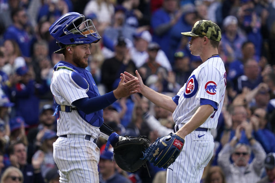 Chicago Cubs relief pitcher Keegan Thompson, right, celebrates with catcher P.J. Higgins after the Cubs defeated the Arizona Diamondbacks in a baseball game in Chicago, Sunday, May 22, 2022. The Cubs won 5-4. (AP Photo/Nam Y. Huh)