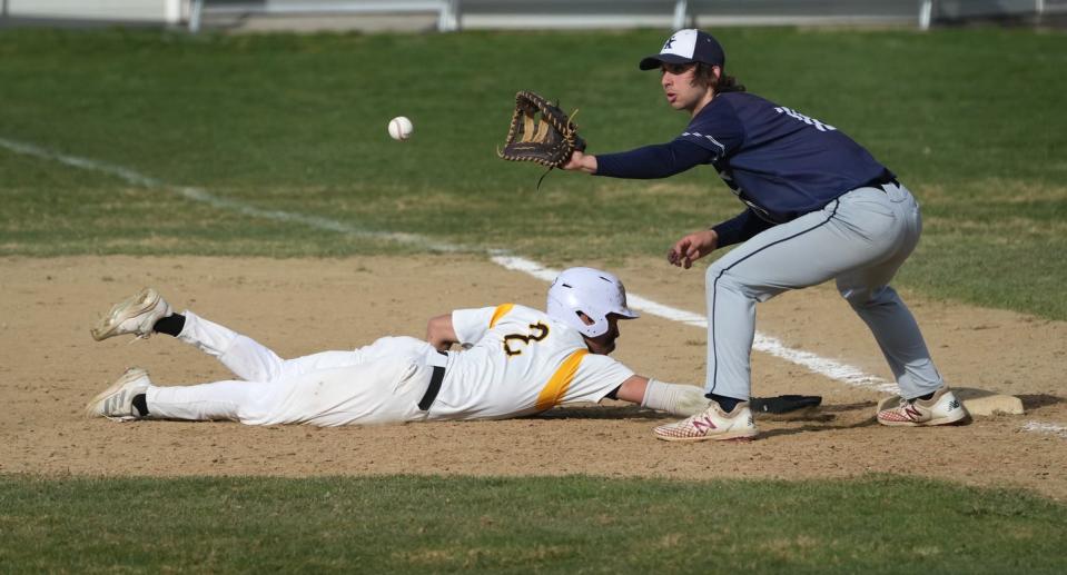 South Kingstown Rebel first baseman Eric Lindley waits for a throw trying to pick off Central runner Avery Acuna during a game last week.