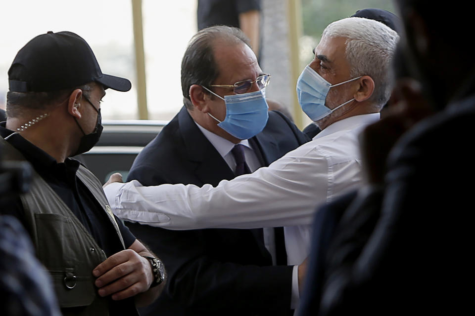 Yehiyeh Sinwar, right, the top Hamas leader in Gaza, hugs head of the Egyptian General Intelligence Abbas Kamel as they meet in Gaza Monday, May 31, 2021. (Mohammed Salem/Pool Photo via AP)