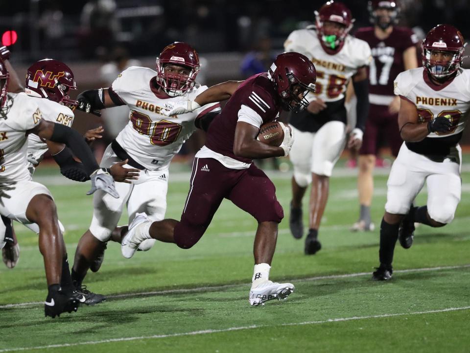 Benedictine's Na'Seir Samuel finds an opening and sprints for yardage ahead of the New Hampstead defense during a Sept. 29th game at Memorial Stadium.
