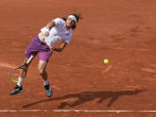 Stefanos Tsitsipas of Greece loses grip of his racket as he serves to Spain's Pedro Martinez during their second round match on day four of the French Open tennis tournament at Roland Garros in Paris, France, Wednesday, June 2, 2021. (AP Photo/Michel Euler)