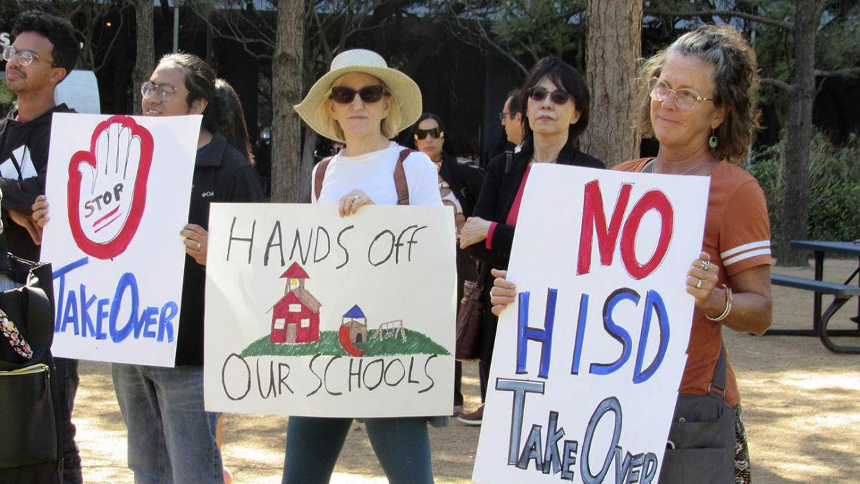 People protest the proposed takeover of Houston's school district by the Texas Education Agency