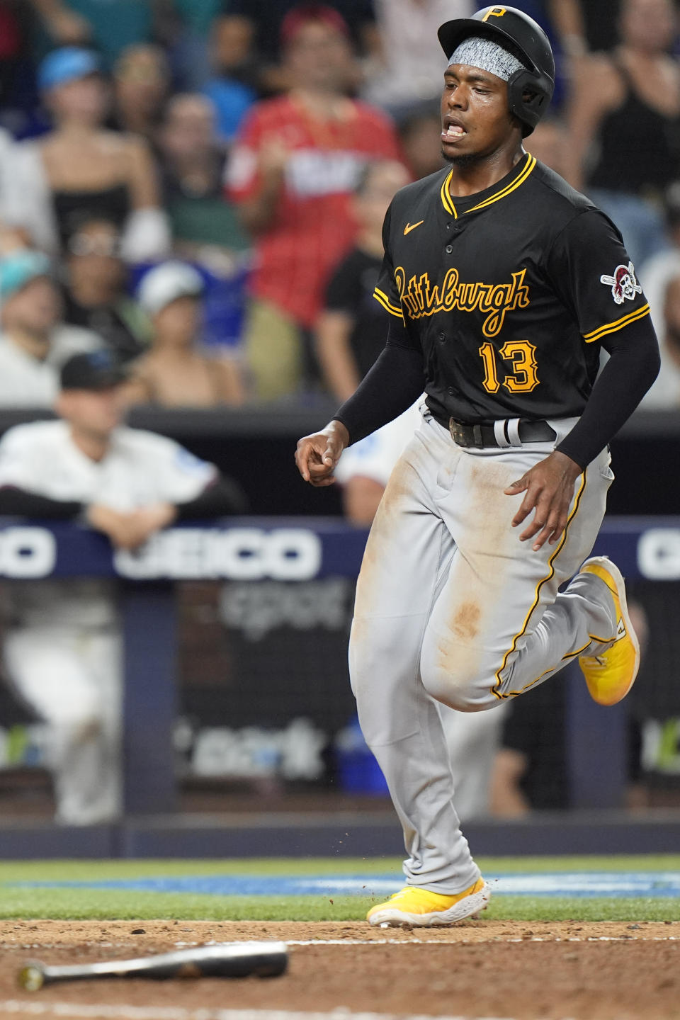Pittsburgh Pirates' Ke'Bryan Hayes scores on a single from Jared Triolo during the 12th inning of a baseball game against the Miami Marlins, Thursday, March 28, 2024, in Miami. (AP Photo/Wilfredo Lee)