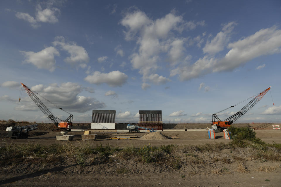 FILE - In this Nov. 7, 2019, file photo the first panels of levee border wall are seen at a construction site along the U.S.-Mexico border in Donna, Texas. A federal appeals court hears arguments against diverting Pentagon money for border wall construction as time runs out. It says the Trump administration has moved quickly to spend the money after the Supreme Court rejected an emergency appeal to prevent work from starting in July. (AP Photo/Eric Gay, File)