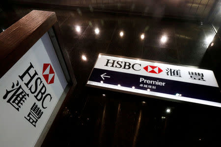 FILE PHOTO: Logos of HSBC are displayed at a major branch at the financial Central district in Hong Kong, China February 21, 2017. REUTERS/Bobby Yip/File Photo