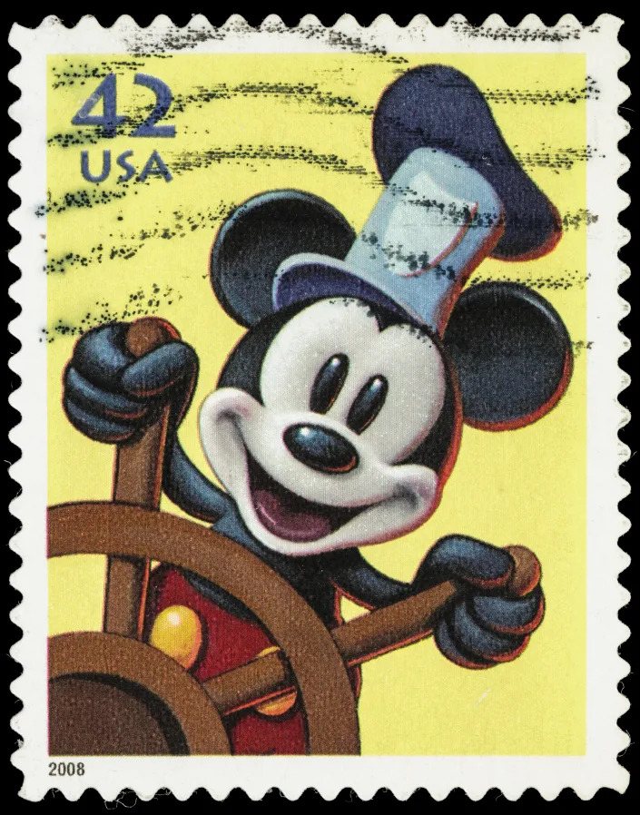 Sacramento, California, USA - June 8, 2012: A 2008 USA postage stamp with Disney&#39;s Mickey Mouse as he appeared in Steamboat Willie, playing the title character. It was the first public appearance of Mickey Mouse.