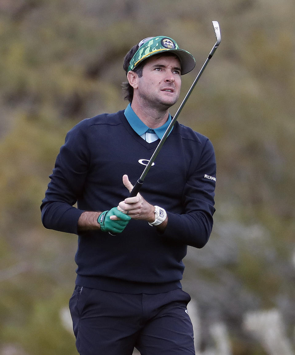 Bubba Watson hits from the second fairway during the third round of the Phoenix Open PGA golf tournament, Saturday, Feb. 2, 2019, in Scottsdale, Ariz. (AP Photo/Matt York)