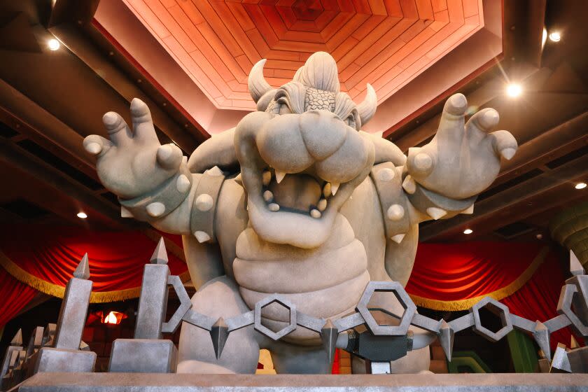 Los Angeles, CA - December 19: A large Bowser is seen inside a recreation of his castle at the first-ever theme park land themed to a video game franchise at Universal Studios Hollywood's Super Nintendo World on Monday, Dec. 19, 2022 in Los Angeles, CA. (Dania Maxwell / Los Angeles Times)