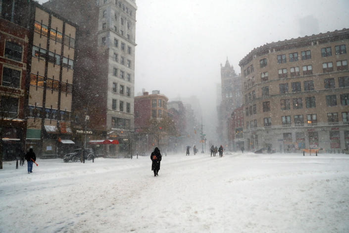 <p>Pedestrian traffic is light in Union Square in New York City during a winter snowstorm on Thursday, Jan. 4, 2018. A massive winter storm swept from the Carolinas to Maine on Thursday, dumping snow along the coast and bringing strong winds that will usher in possible record-breaking cold. (Photo: Gordon Donovan/Yahoo News) </p>