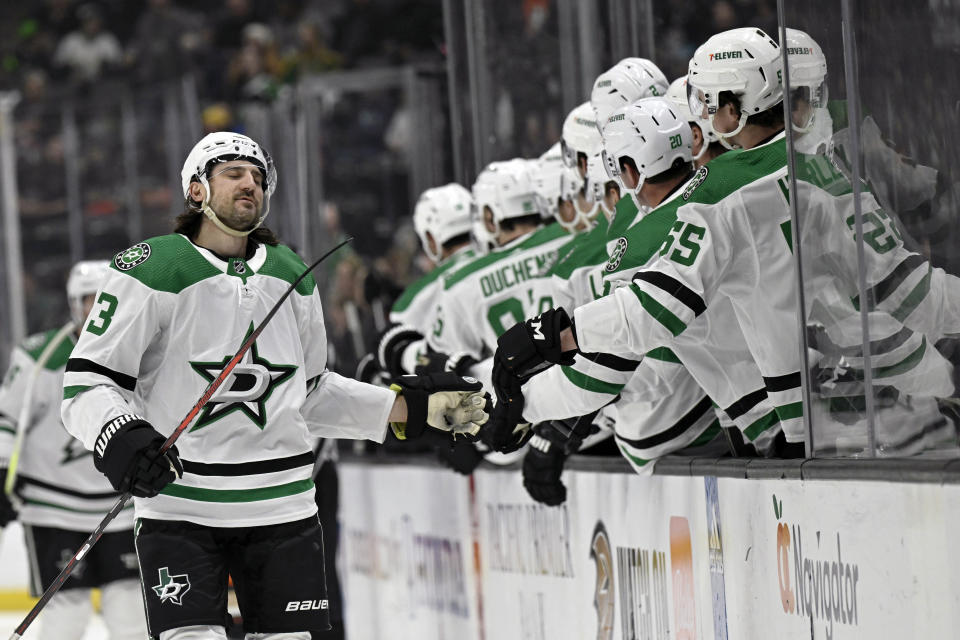 Dallas Stars defenseman Christopher Tanev, left, is congratulated for his goal against the Anaheim Ducks during the first period of an NHL hockey game Friday, March 8, 2024, in Anaheim, Calif. (AP Photo/Alex Gallardo)