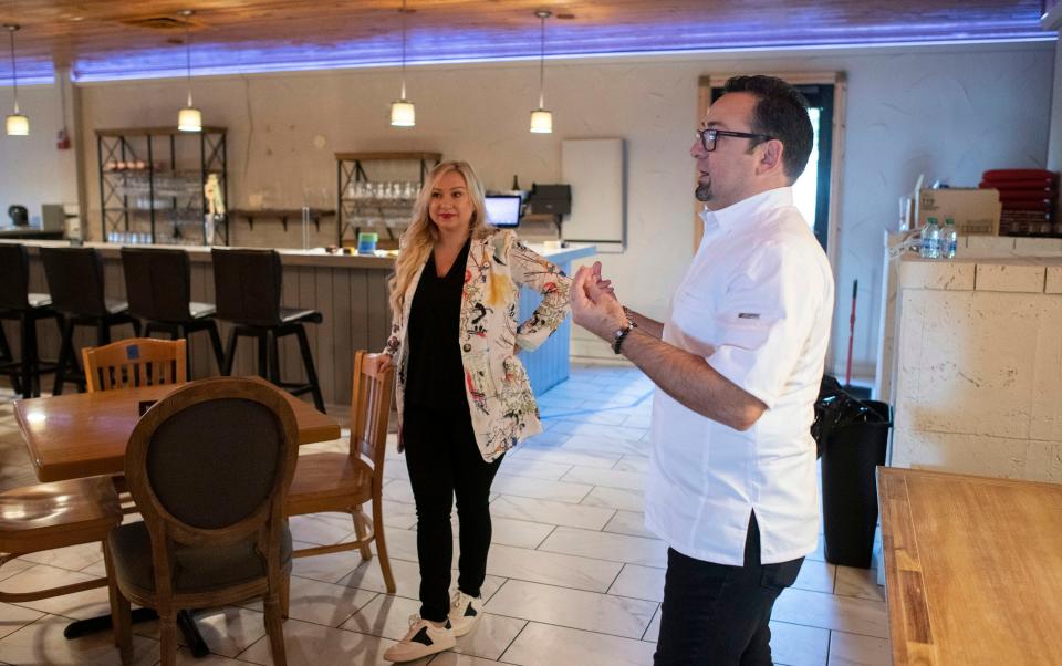 Chef George & Luba Lazi share plans for their newly purchased Alice's restaurant location during a building tour on Monday, March 13, 2023. The restaurateurs own George Bar and Bistro on Ninth Avenue and the Pearl and Horn in downtown Pensacola. 