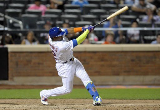 New York Mets' Yoenis Cespedes hits a walk-off home run during the tenth inning of a baseball game against the Miami Marlins Monday, Aug. 29, 2016 at Citi Field in New York. The Mets won 2-1. (AP Photo/Bill Kostroun)