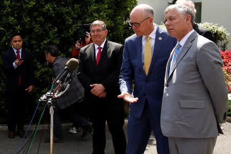 U.S. Representative Greg Walden (R-OR) (2nd R) makes way for Representative Fred Upton (R-MI) (R) to speak to reporters about health care legislation after meeting with President Trump at the White House in Washington, U.S. May 3, 2017. REUTERS/Jonathan Ernst