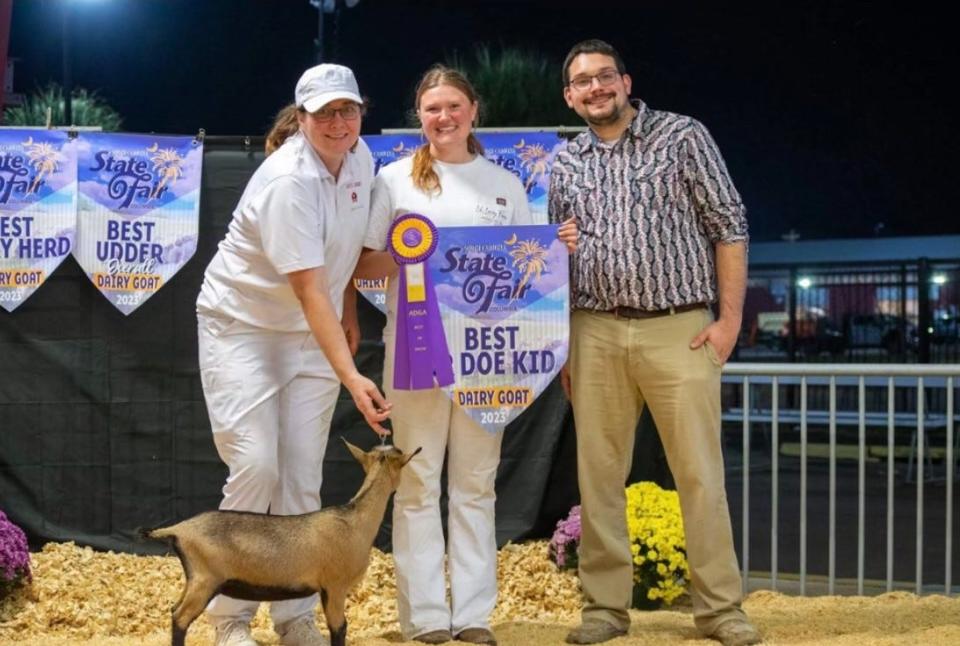 Shannon Lodge (far left) celebrates after one of her goats won Best Junior Doe in the Entire Show at the South Carolina State Fair.