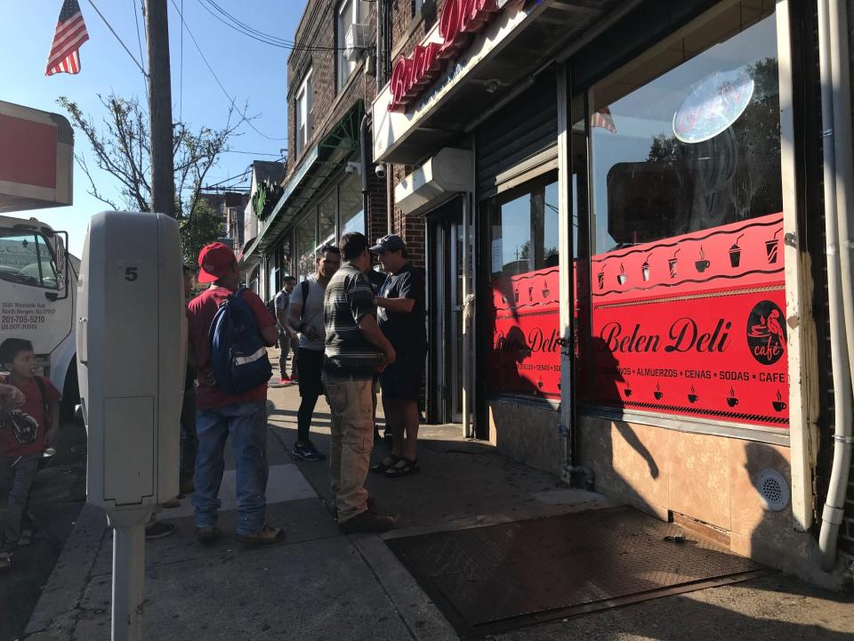 Day laborers negotiate work in Palisades Park, New Jersey, on July 16, 2019.