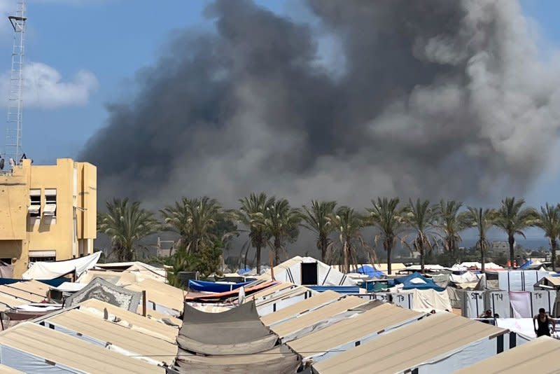 Smoke rises above the tents of displaced Palestinians after an Israeli military strike on the al-Mawasi camp near the southern Gaza Strip town of Khan Yunis on Saturday. Photo: Saber Arar/UPI