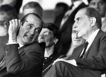 FILE PHOTO: File photo of Jacques Chirac, French Prime Minister and Mayor of Paris, speaking with French Socialist President Francois Mitterrand in this undated picture