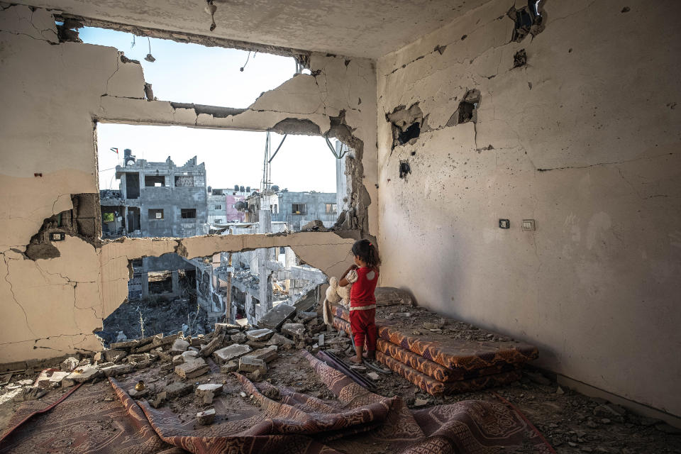 With a cease-fire in effect, a Palestinian girl stands in her destroyed home in Beit Hanoun, Gaza, on May 24.<span class="copyright">Fatima Shbair—Getty Images</span>