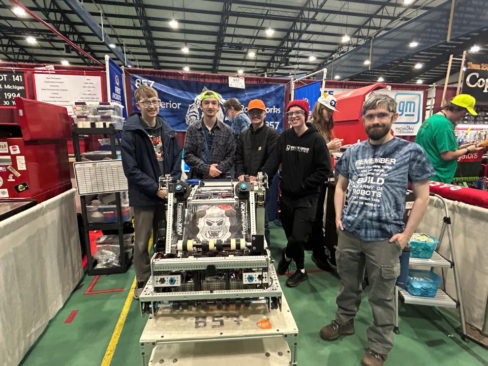 The Superior Roboworks team from Houghton and their robot Francois the 24th pose for a photo during the first day of the FIRST Robotics competition at LSSU on March 14, 2024.