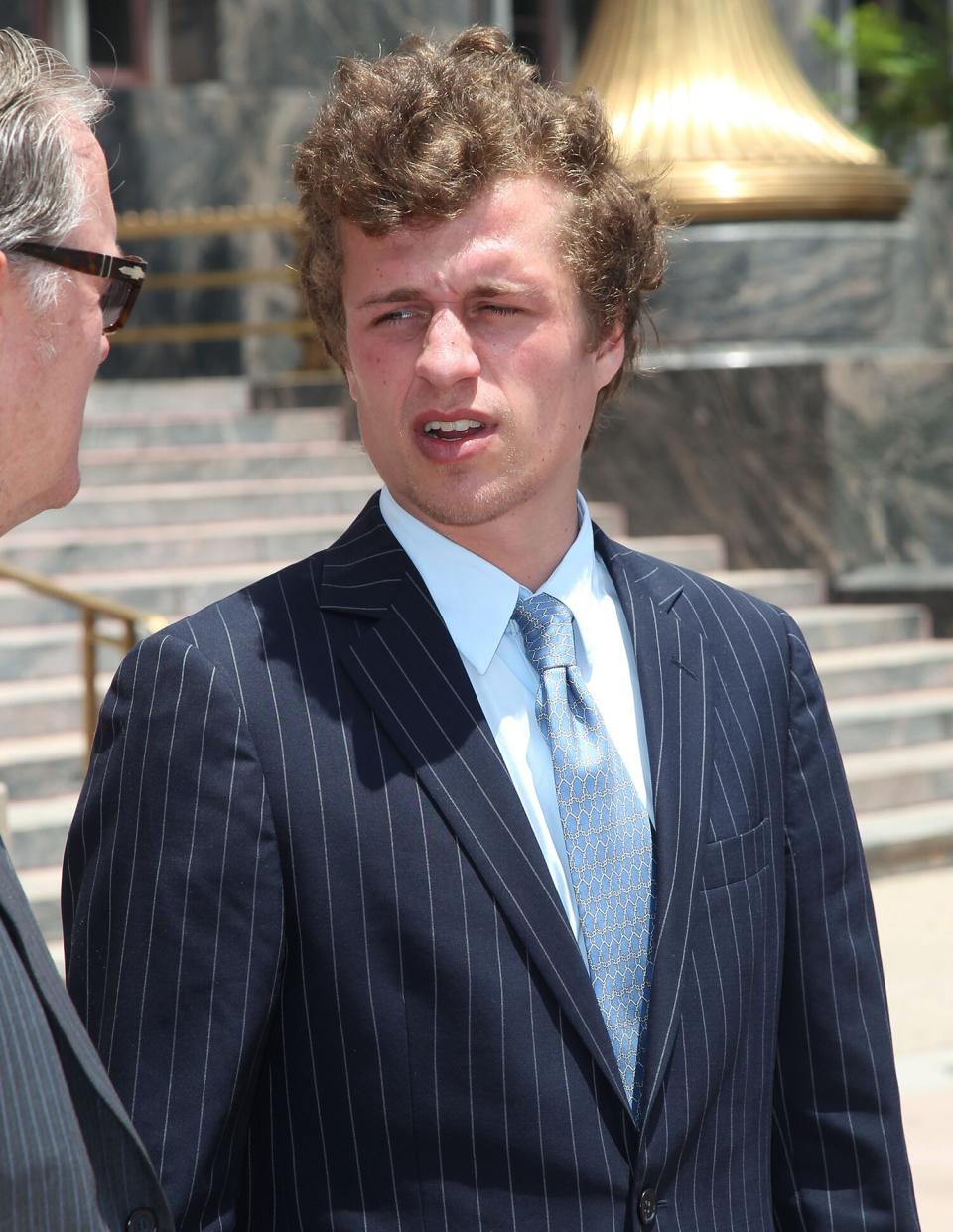 Conrad Hilton (R) and his Father Richard Hilton attend court for Conrad's sentencing after causing a disturbance aboard an international flight from London to Los Angeles last summer at Roybal Federal Building