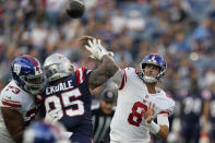 New York Giants quarterback Daniel Jones (8 throws a pass over New England Patriots defensive tackle Daniel Ekuale (95) during the first half of a preseason NFL football game Thursday, Aug. 11, 2022, in Foxborough, Mass. (AP Photo/Charles Krupa)