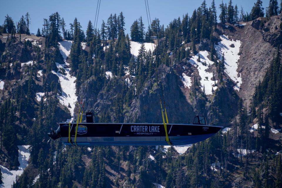 Delivered by helicopter, tour boats built for the deepest lake in America arrived June 26, 2023, at Crater Lake National Park.