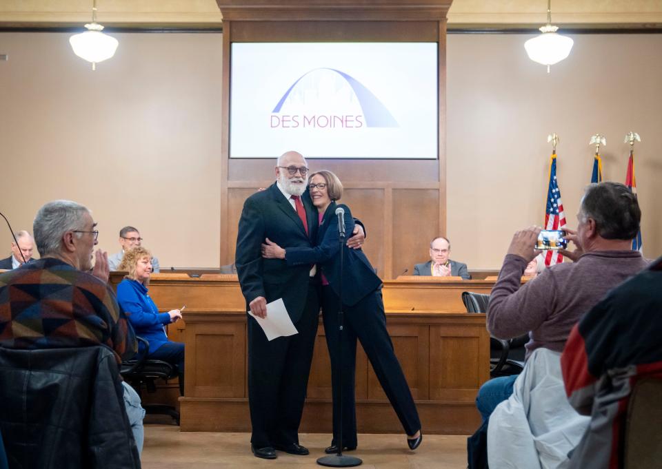 Connie Boesen hugs her husband Ted Bosen after being sworn in as Des Moines Mayor before at city council meeting, Monday, Jan. 8, 2024.