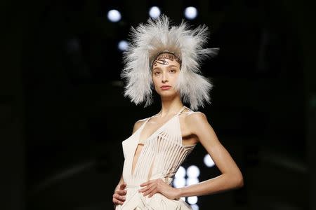 A model presents a creation by French designer Jean Paul Gaultier as part of his Haute Couture Spring Summer 2015 fashion show in Paris January 28, 2015. REUTERS/Gonzalo Fuentes