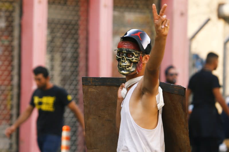 A demonstrator gestures during the ongoing anti-government protests in Baghdad