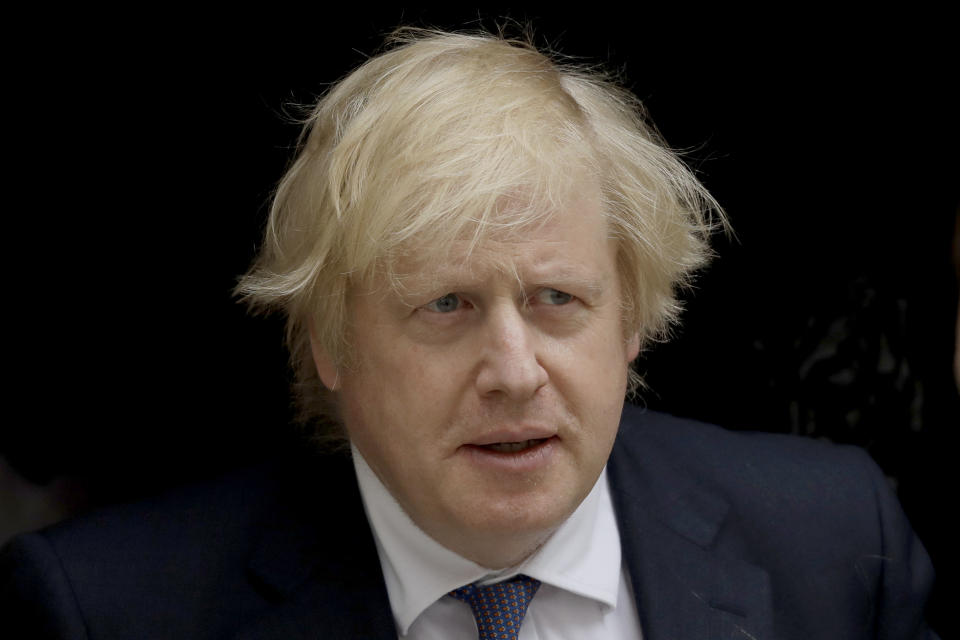 British Prime Minister Boris Johnson leaves 10 Downing Street in London, to attend the weekly Prime Minister's Questions at the Houses of Parliament, in London, Wednesday, July 1, 2020. (AP Photo/Matt Dunham)