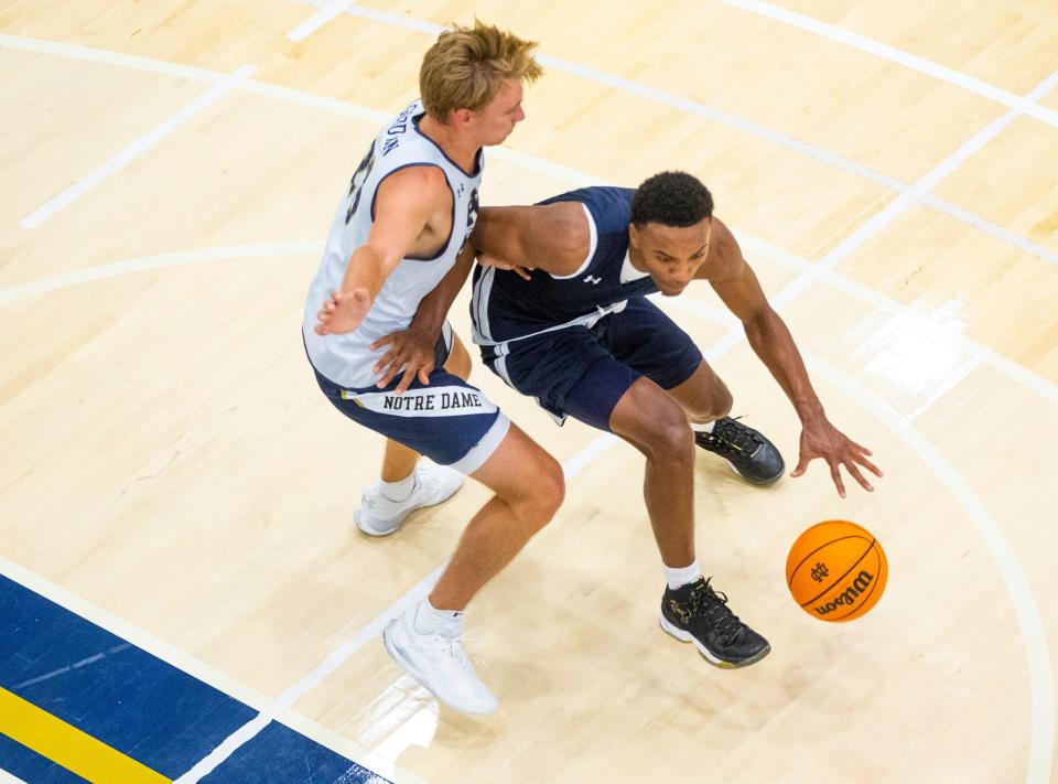 Notre Dame's J.J. Starling works against Dane Goodwin during practice Tuesday, July 19, 2022 at the Rolfs Athletics Hall in South Bend. 