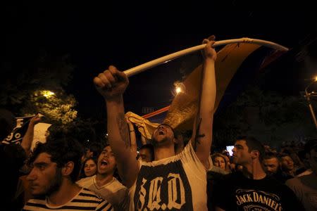 Protesters shout slogans during a rally against a recent decision to raise public electricity prices in Yerevan, Armenia, June 23, 2015. REUTERS/Hrant Khachatryan/PAN Photo