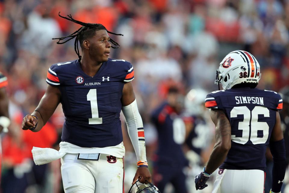 Auburn quarterback TJ Finley (1) runs off the field after the win over Georgia State in an NCAA college football game Saturday, Sept. 25, 2021, in Auburn, Ala. (AP Photo/Butch Dill)