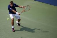 Sep 3, 2015; New York, NY, USA; Stan Wawrinka of Swizterland hits a backhand against Hyeon Chung of Korea (not pictured) on day four of the 2015 U.S. Open tennis tournament at USTA Billie Jean King National Tennis Center. Wawrinka won 7-6 (2), 7-6 (4), 7-6 (6). Mandatory Credit: Geoff Burke-USA TODAY Sports