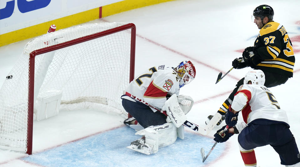 Boston Bruins center Patrice Bergeron (37) scores against Florida Panthers goaltender Sergei Bobrovsky (72) during the second period of an NHL hockey game, Monday, Oct. 17, 2022, in Boston. (AP Photo/Charles Krupa)