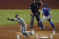 Tampa Bay Rays' Brandon Lowe watches his home run against the Los Angeles Dodgers during the first inning in Game 2 of the baseball World Series Wednesday, Oct. 21, 2020, in Arlington, Texas. (AP Photo/Sue Ogrocki)