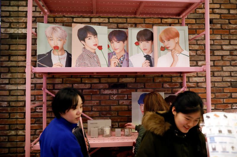 Fans of K-pop idol boy band BTS shop at a pop-up store selling BTS goods in Seoul