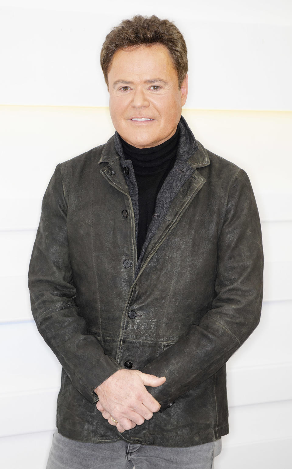 Donny Osmond wears leather jacket