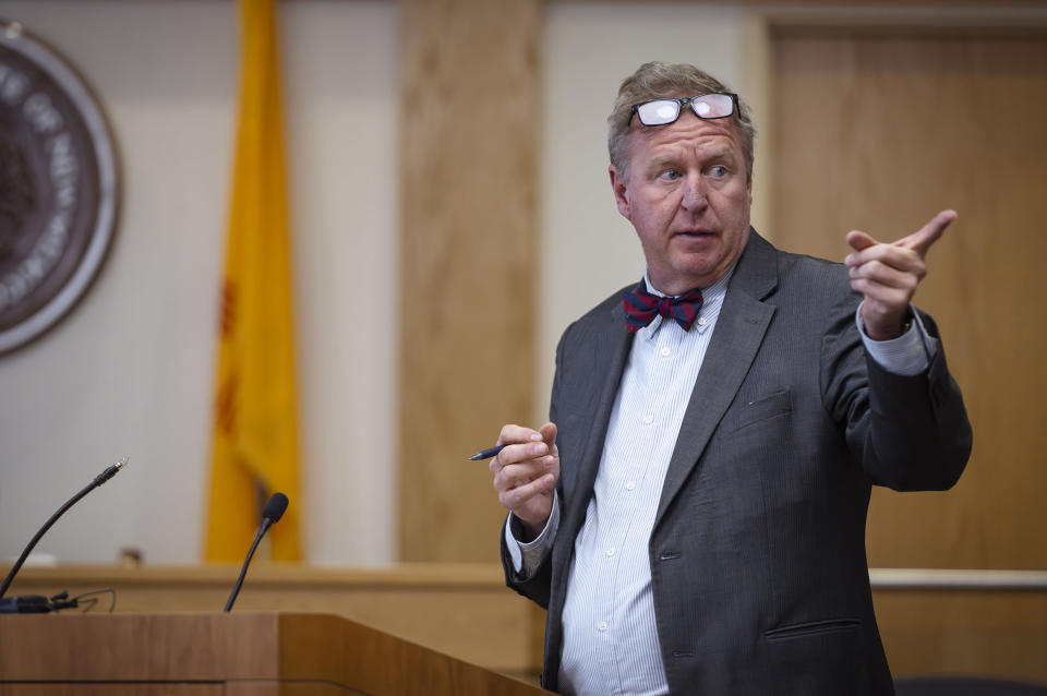 Defense attorney Thomas Clark points to Muhammad Syed during opening statements in the trial Syed at the Bernalillo County Courthouse in Downtown Albuquerque, N.M,, on Tuesday, March 12, 2024. Syed, an Afghan refugee, is accused in the slayings of three Muslim men in Albuquerque. (Chancey Bush/The Albuquerque Journal via AP, Pool)