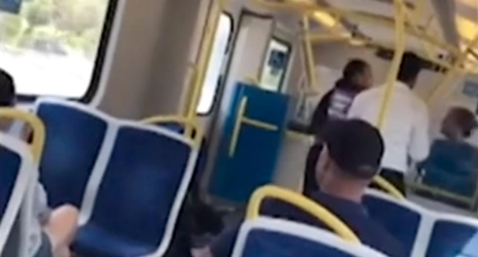 Footage captured a woman hurling abuse at Fahima Adan on a carriage in the city’s south-east. Source: 7 News