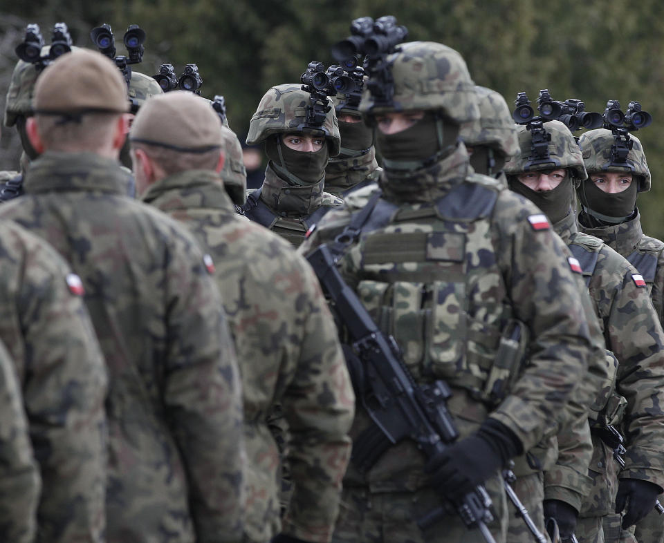 FILE - In this March 10, 2019 photo Polish troops in combat gear are seen during brief exercise with some other NATO forces in Wesola, near Warsaw, central Poland. Poland’s foreign minister says that this NATO nation should not exclude the possibility of sending its troops to Ukraine and should keep Russian leader Vladimir Putin in suspence as to such a decision being ever made. (AP Photo/Czarek Sokolowski, File)