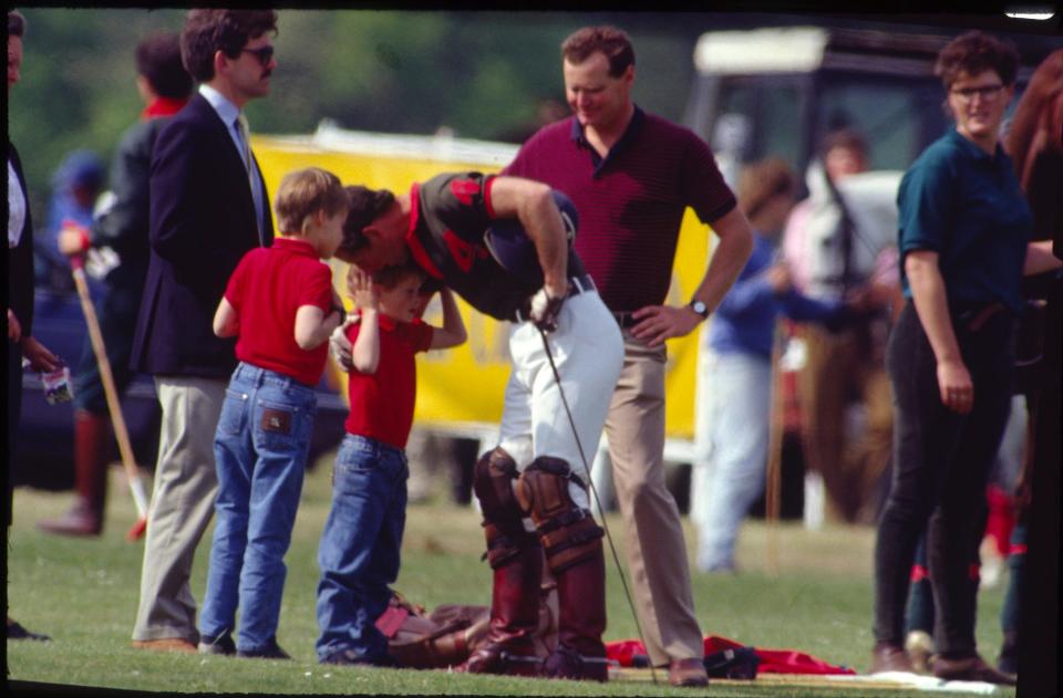 Prince Charles with William and Harry at a polo match in 1990.