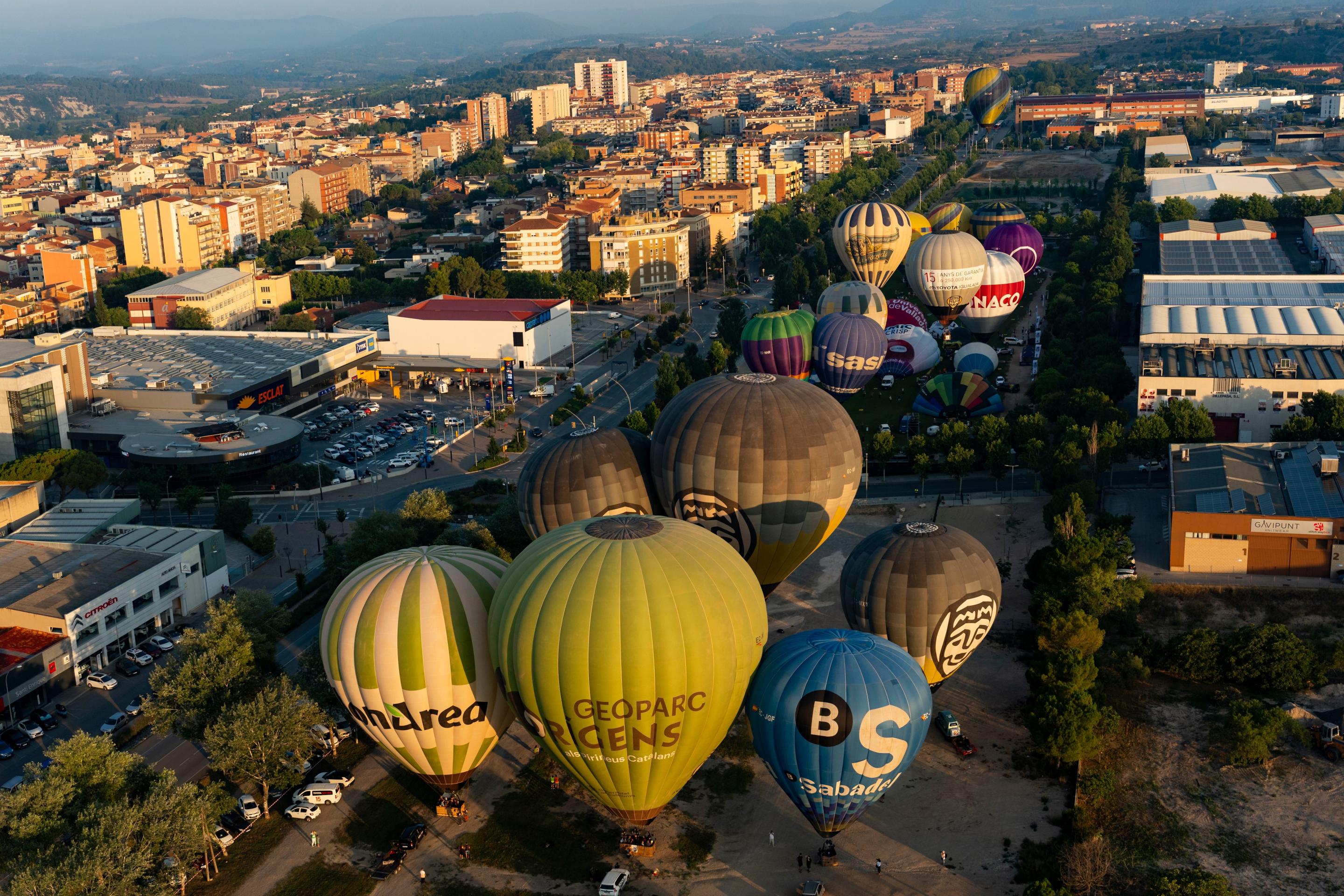 Several balloons are about to participate in the inaugural flight of the 28th European Balloon Festival in Igualada, Spain, on July 11.