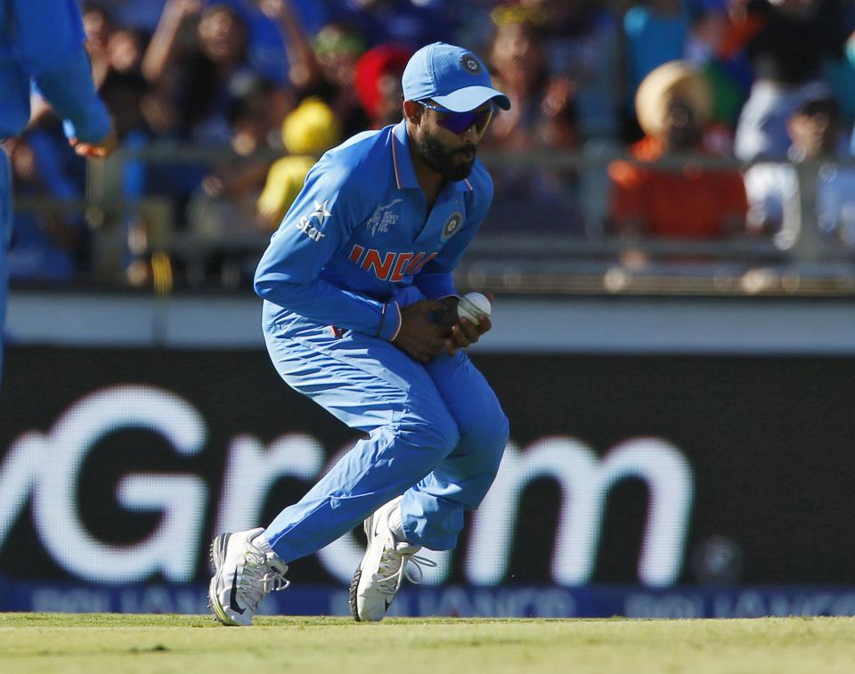 Ravindra Jadeja puts down a high catch in Perth against the West Indies. 