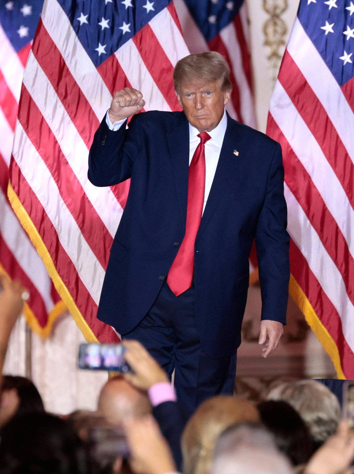 Former President Donald Trump pumps his fist as he reacts to the crowd after he announced his bid for another term as president from his Mar-a-Lago club in Palm Beach, Florida, on Tuesday, Nov. 15, 2022.