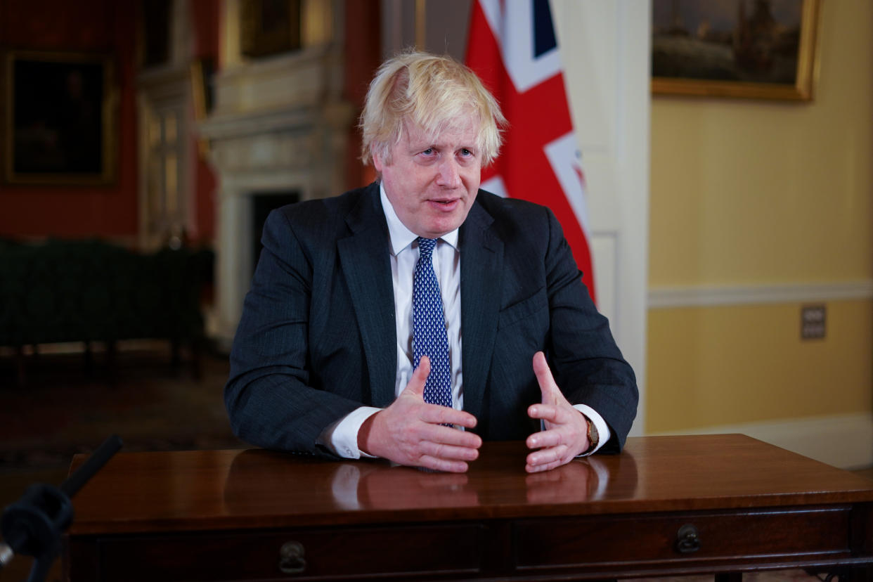 Prime Minister Boris Johnson, gestures as he records an address to the nation at Downing Street, London, to provide an update on the booster vaccine programme. See PA story HEALTH Coronavirus. Photo credit should read: Kirsty O'Connor/PA Wire