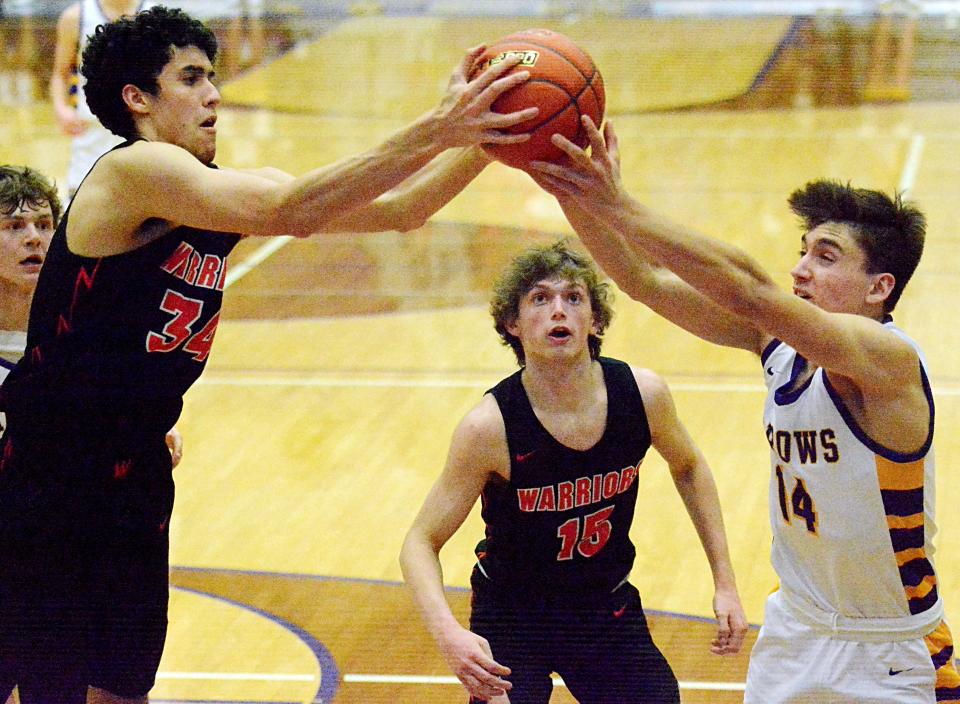 Sioux Falls Washington's Gage Gasca (left) and Watertown's Will Engstrom battle for a rebound as Washington's Cole Peterson looks on during a high school boys basketball game on Friday, Feb. 3, 2023 in the Watertown Civic Arena.